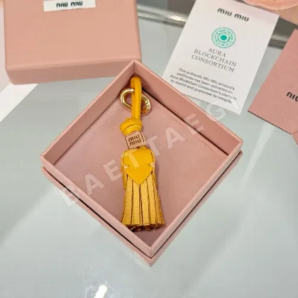 미우미우 투톤 가죽 풍차형 키링 155729